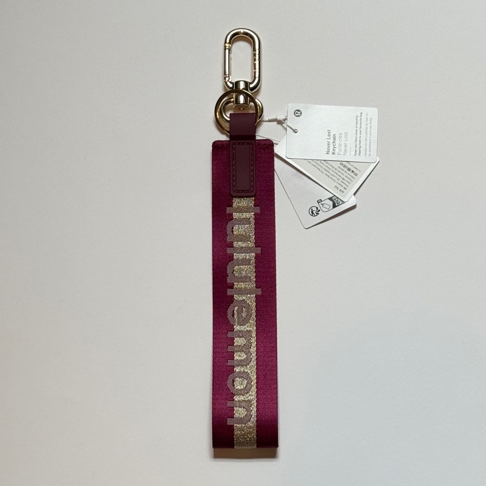 NWT Lululemon Never Lost Keychain Wordmark Deep Luxe/Gold/Bone Special Edition!